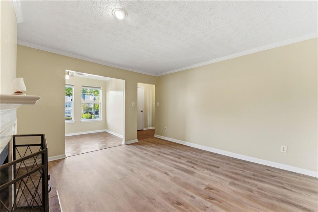 2043 Brian Way Decatur, GA 30033 - Photo 4 of 25 wooden floor in an empty room with a window
