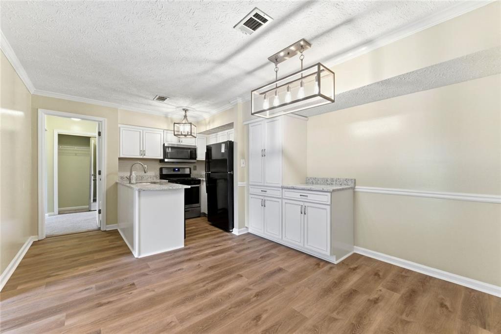 2043 Brian Way Decatur, GA 30033 - Photo 7 of 25 a kitchen with refrigerator and cabinets