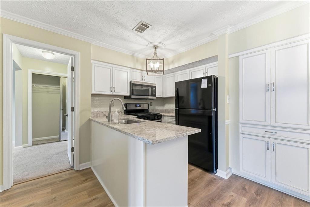 2043 Brian Way Decatur, GA 30033 - Photo 9 of 25 a kitchen with a refrigerator a sink and dishwasher