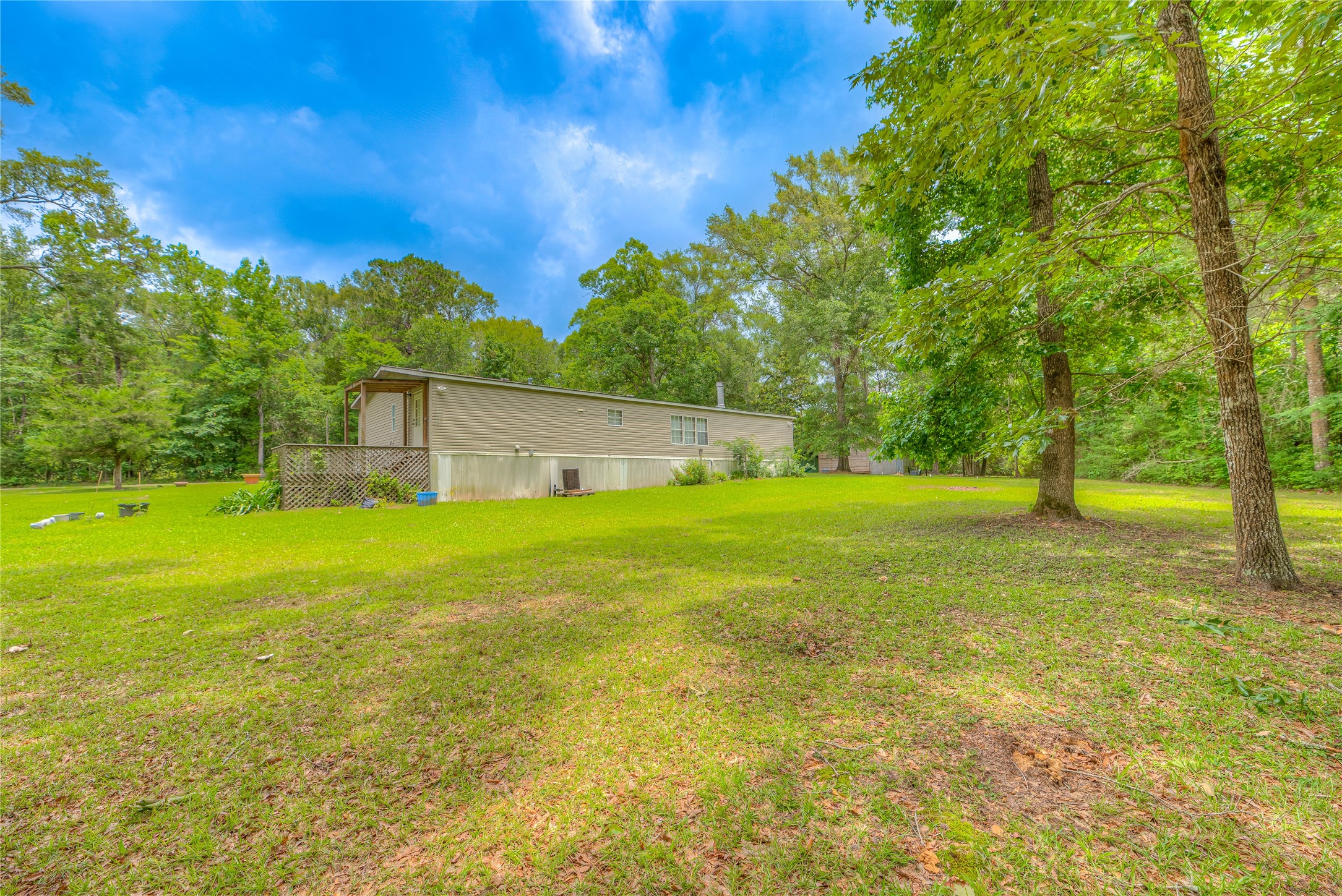 657 Parrish Road Livingston, TX 77351 - Photo 25 of 47 a view of a house with a backyard