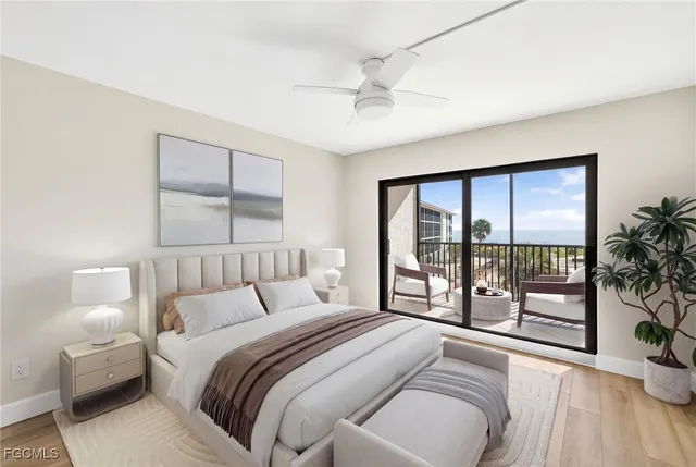 a bedroom with a large bed and a large window