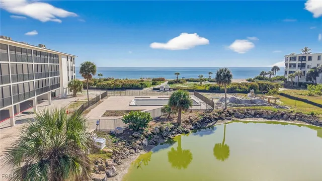 a view of a swimming pool with a table and chairs