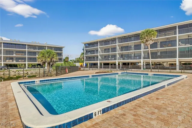 a view of a swimming pool with a patio