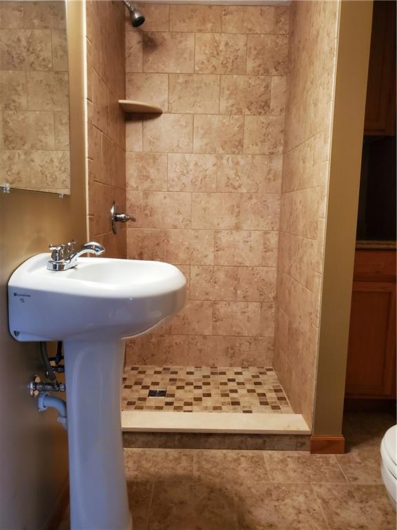 861 New Castle Road Slippery Rock, PA 16057 - Photo 12 of 22 Remodeled bath with beautiful ceramic tile shower.