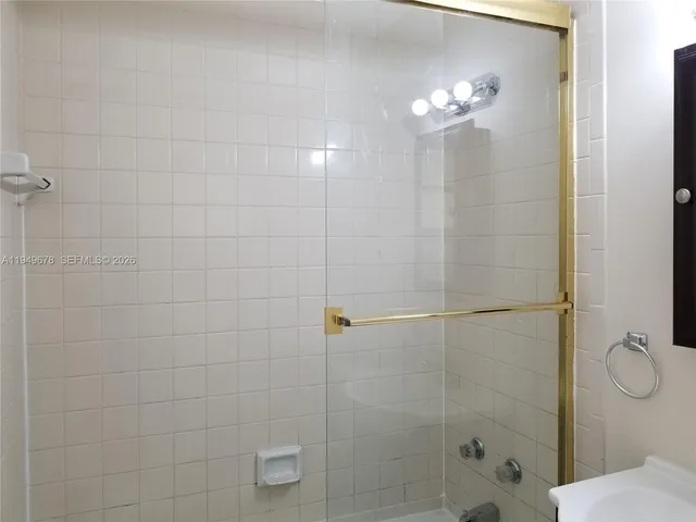 a view of a bathroom from a hallway