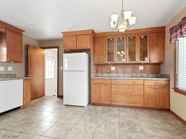 284 Wilson Street Struthers, OH 44471 - Photo 4 of 16 Kitchen with brown cabinets, white appliances, a chandelier, and glass insert cabinets