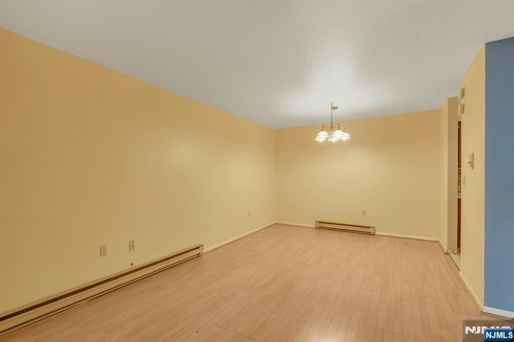 666 Mill Street, Unit C6 Belleville, NJ 07109 - Photo 8 of 25 an empty room with a empty space and a window