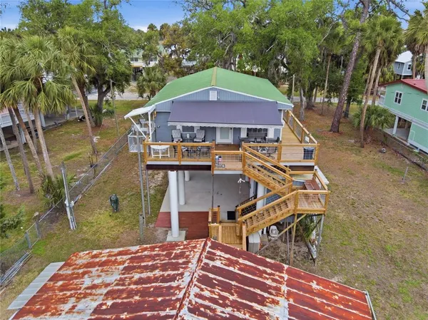 an aerial view of house with a yard