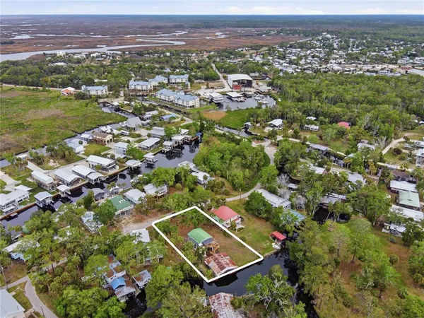 an aerial view of a house with a lake view