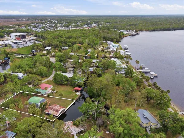 an aerial view of a house with balcony and swimming pool