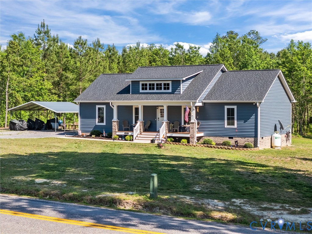 10819 Vaughan Road Petersburg, VA 23805 - Photo 2 of 45 Blue siding residence featuring a covered front po