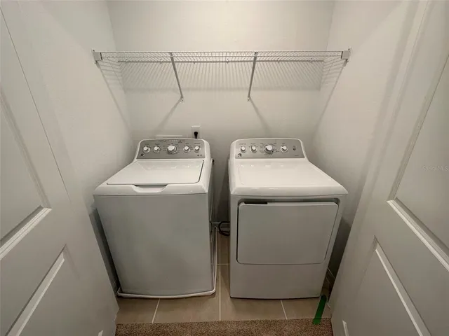 a utility room with dryer and washer