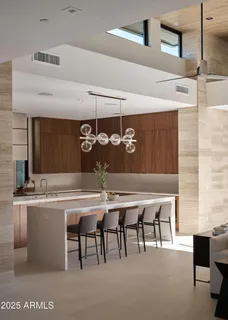 a kitchen with a sink and a stove top oven