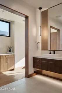 a bathroom with a double vanity sink mirror and double