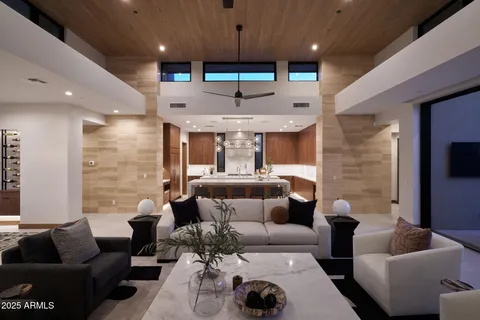 a room with furniture pool table and flat screen tv