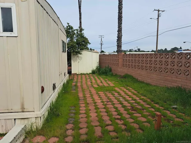 a view of a pathway with a yard