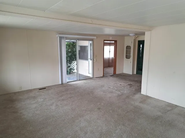 a view of a big room with windows and closet