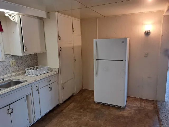 a view of a storage & utility room with wooden floor