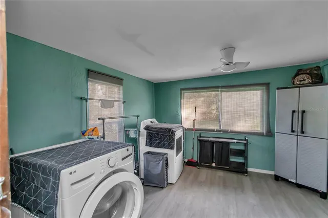 a kitchen with stainless steel appliances granite countertop a refrigerator and a stove