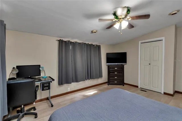 a bathroom with a shower a toilet and bathtub