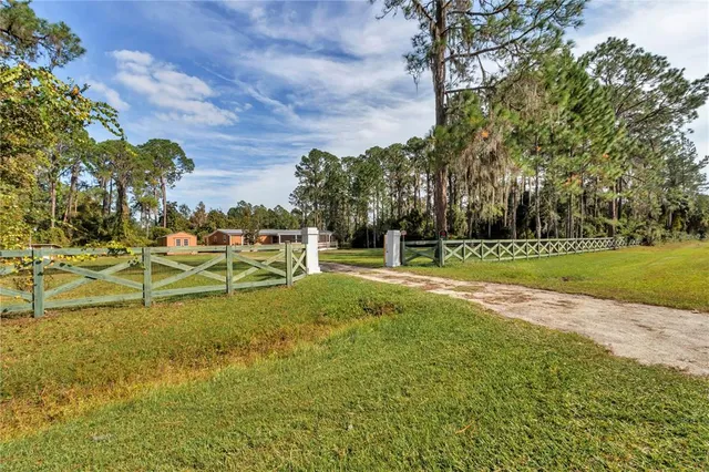 a backyard of apartments with large trees