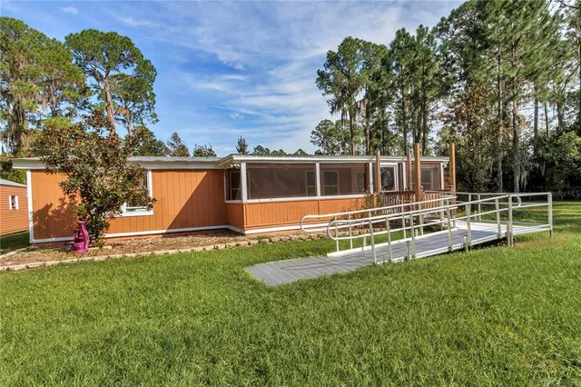 front view of a house with a big yard