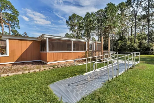 a balcony with furniture and a potted plant