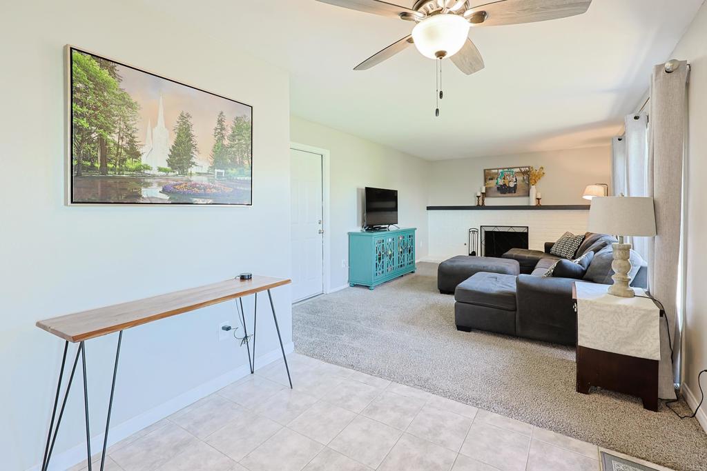 10225 Molino Road Santee, CA 92071 - Photo 16 of 53 a living room with furniture and a chandelier