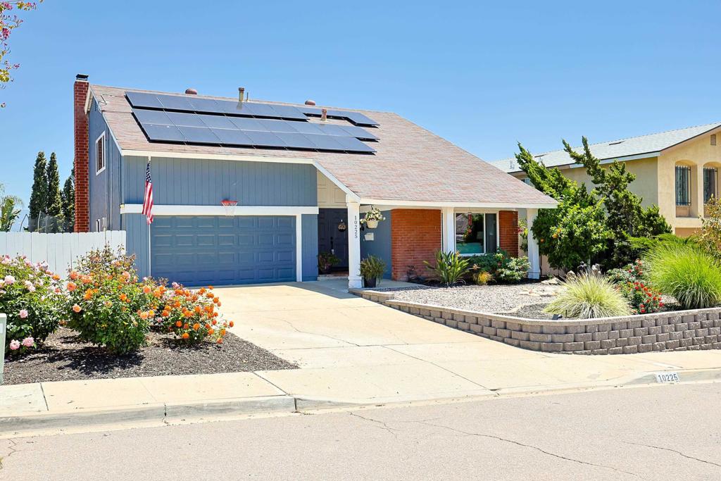 10225 Molino Road Santee, CA 92071 - Photo 3 of 53 a front view of a house with a yard and a garage