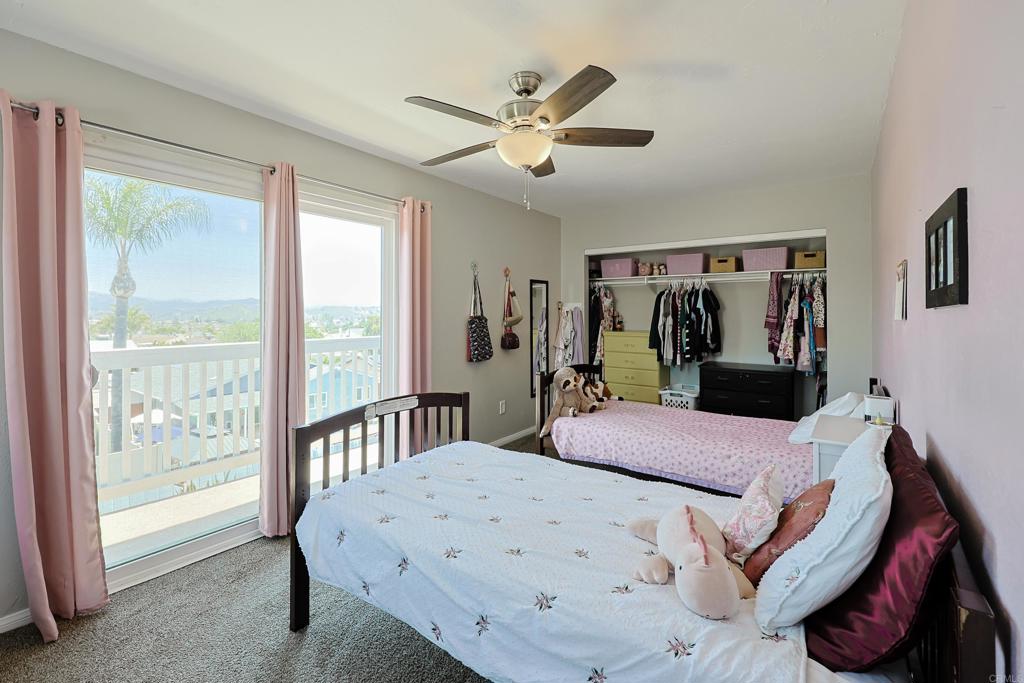10225 Molino Road Santee, CA 92071 - Photo 33 of 53 a bed room with a bed and a large window