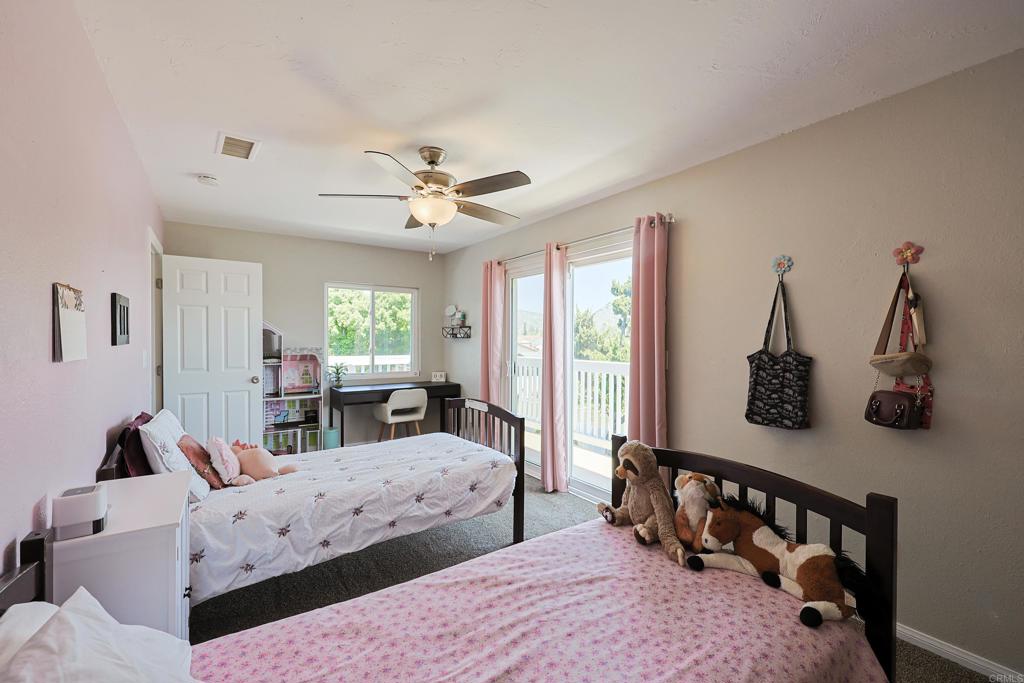 10225 Molino Road Santee, CA 92071 - Photo 34 of 53 a bedroom with furniture and windows