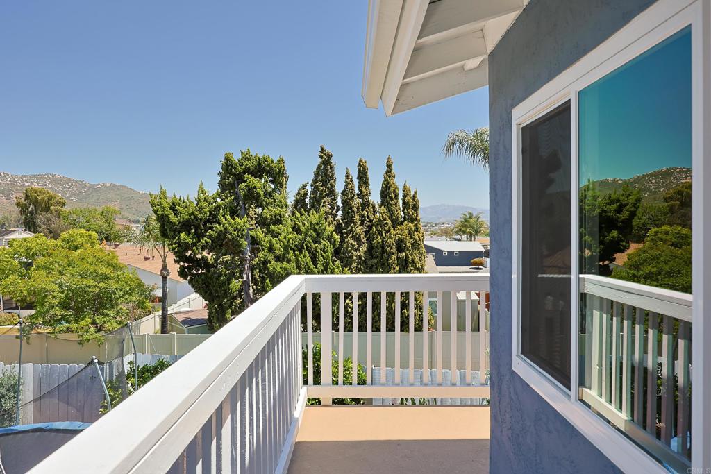 10225 Molino Road Santee, CA 92071 - Photo 36 of 53 a view of a balcony with a floor to ceiling window and wooden fence