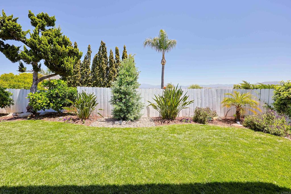 10225 Molino Road Santee, CA 92071 - Photo 40 of 53 a view of a garden with a building in the background