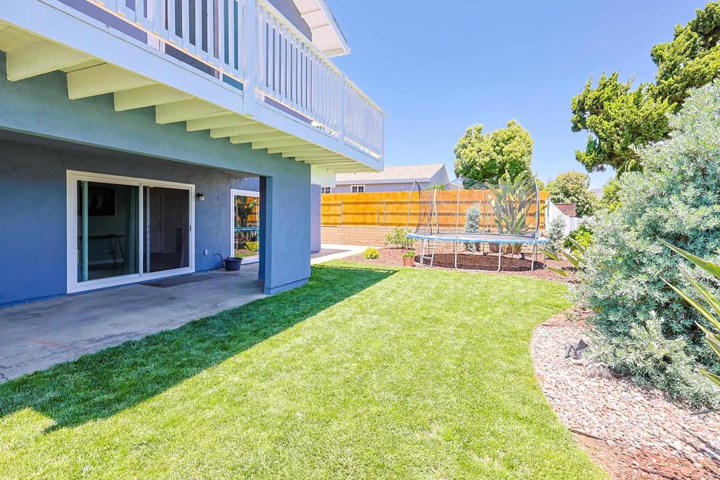10225 Molino Road Santee, CA 92071 - Photo 41 of 53 a view of a house with a yard and potted plants
