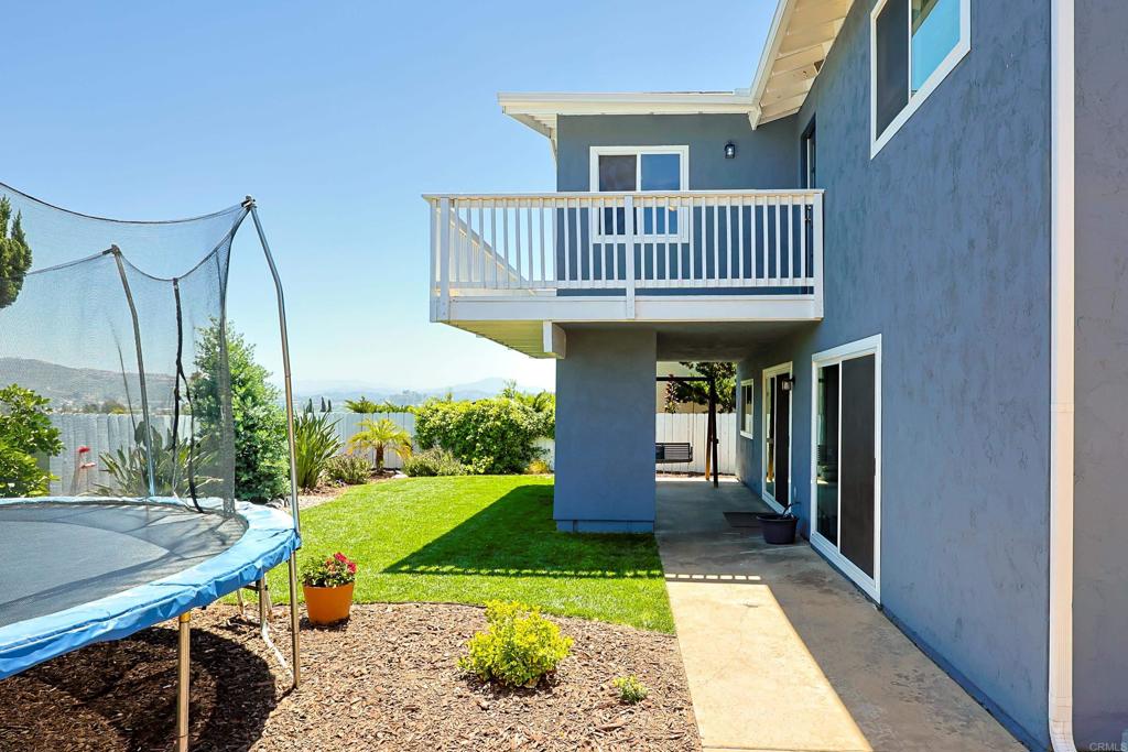 10225 Molino Road Santee, CA 92071 - Photo 47 of 53 a view of a house with a porch and furniture