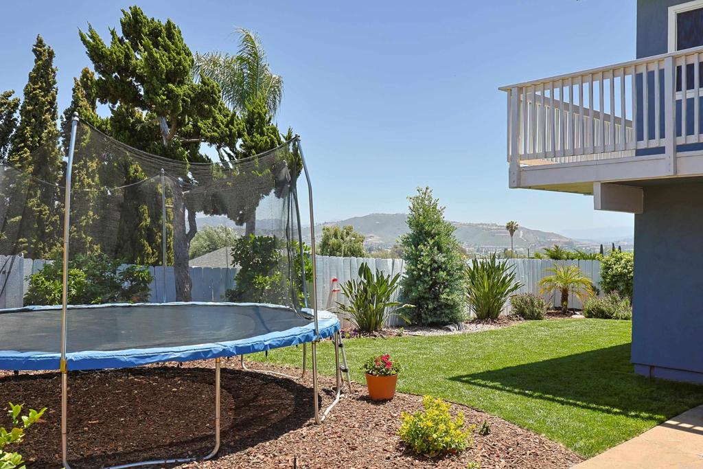 10225 Molino Road Santee, CA 92071 - Photo 48 of 53 a view of a backyard with plants and a patio