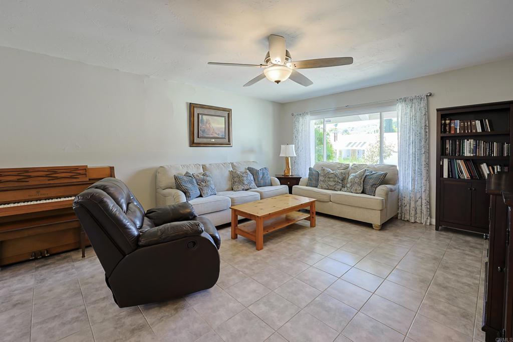 10225 Molino Road Santee, CA 92071 - Photo 6 of 53 a living room with furniture and a ceiling fan