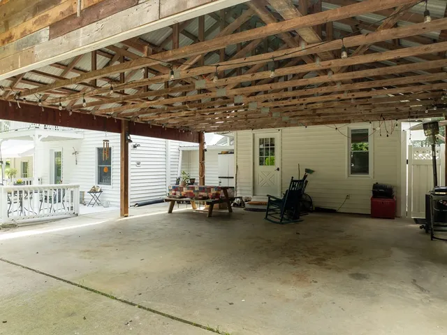 a bedroom with a bed and a tv