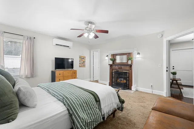 a bathroom with a toilet a sink and a mirror