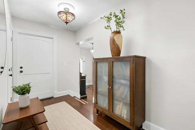 a kitchen with a refrigerator and a sink