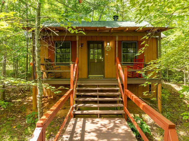 an aerial view of a house with yard swimming pool and outdoor seating
