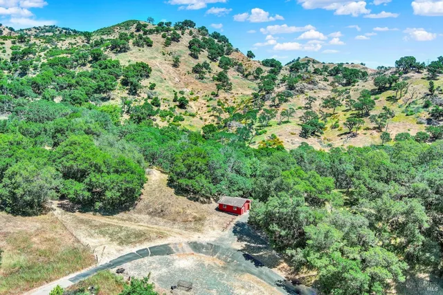 a view of a lake with a yard