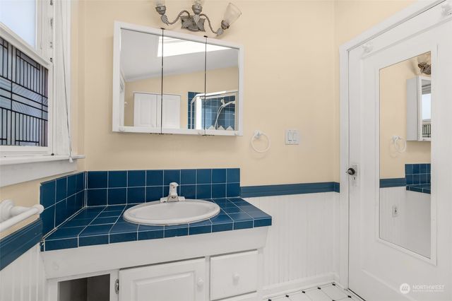 a view of an empty room with a fan