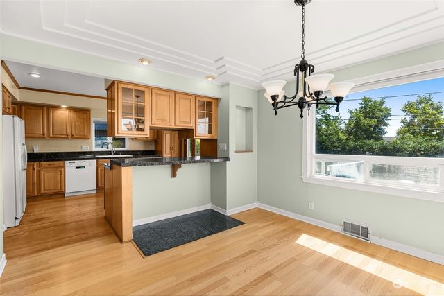a view of an empty room with a fireplace