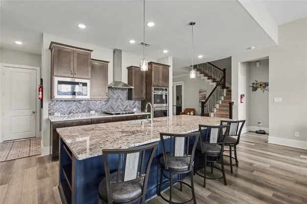 a kitchen with a table and chairs in it