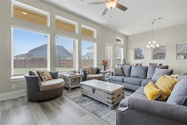 a living room with furniture and a large window