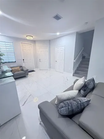 a living room with furniture and a couch