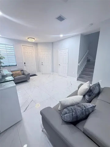 a living room with furniture and a couch