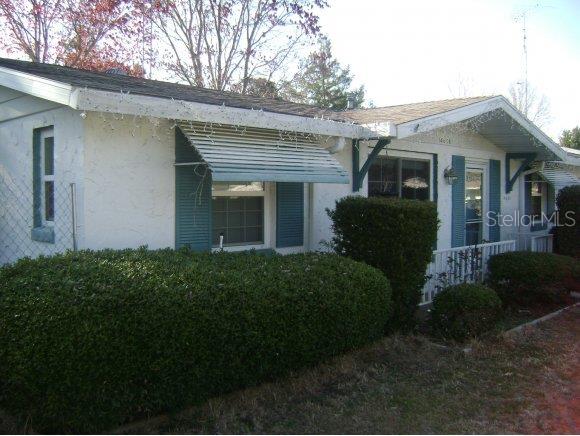 14658 Southwest 34th Terrace Road Ocala, FL 34473 - Photo 1 of 1 a front view of a house with garden