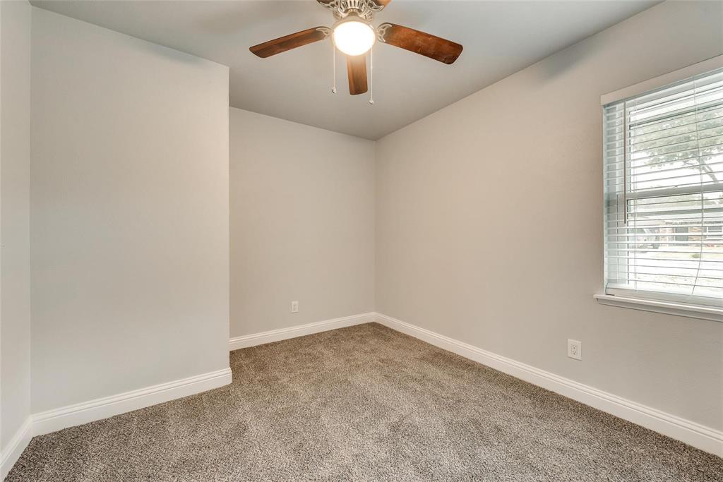 5220 Arbor Glen Road The Colony, TX 75056 - Photo 16 of 29 an empty room with a window and a fan